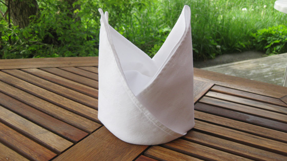 White napkin in damask - folded as a mitre